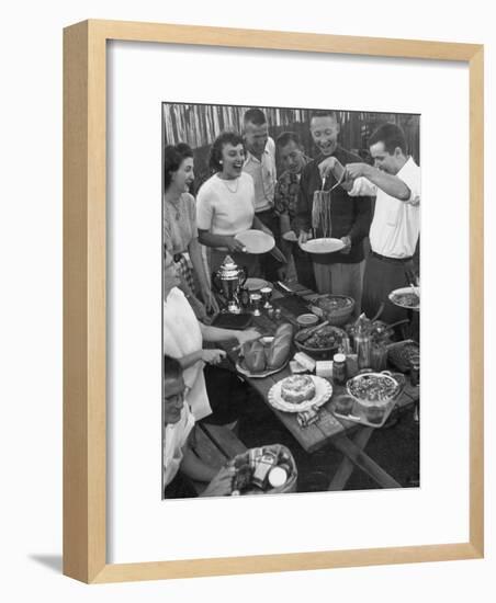 Young Married Couples Enjoying a Backyard Buffet Feast , Featuring Spaghetti-Nina Leen-Framed Photographic Print