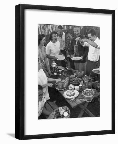 Young Married Couples Enjoying a Backyard Buffet Feast , Featuring Spaghetti-Nina Leen-Framed Photographic Print