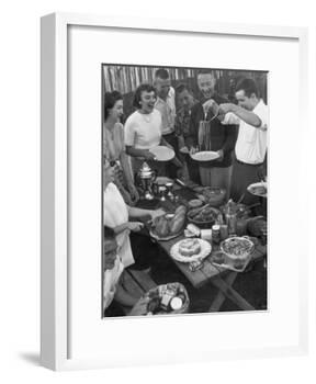 Young Married Couples Enjoying a Backyard Buffet Feast , Featuring Spaghetti-Nina Leen-Framed Photographic Print
