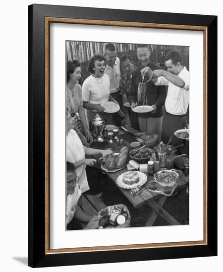 Young Married Couples Enjoying a Backyard Buffet Feast , Featuring Spaghetti-Nina Leen-Framed Photographic Print