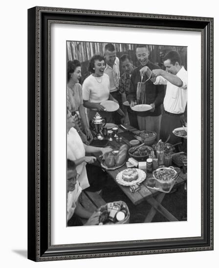 Young Married Couples Enjoying a Backyard Buffet Feast , Featuring Spaghetti-Nina Leen-Framed Photographic Print