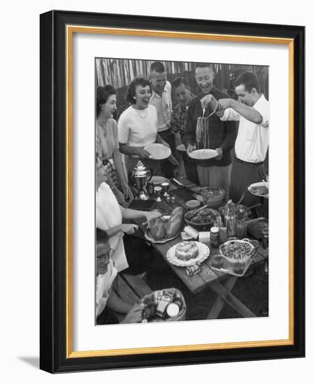 Young Married Couples Enjoying a Backyard Buffet Feast , Featuring Spaghetti-Nina Leen-Framed Photographic Print