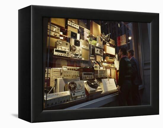 Young Men Men Look at a Window Display of Stereo and Recording Equipment, New York, NY, 1963-Yale Joel-Framed Premier Image Canvas