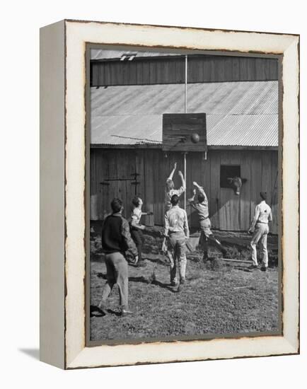 Young Men Playing Basketball with a Homemade Basket in a Farmyard-null-Framed Premier Image Canvas