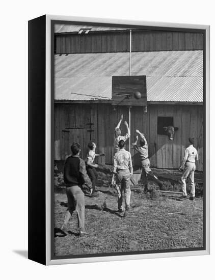 Young Men Playing Basketball with a Homemade Basket in a Farmyard-null-Framed Premier Image Canvas