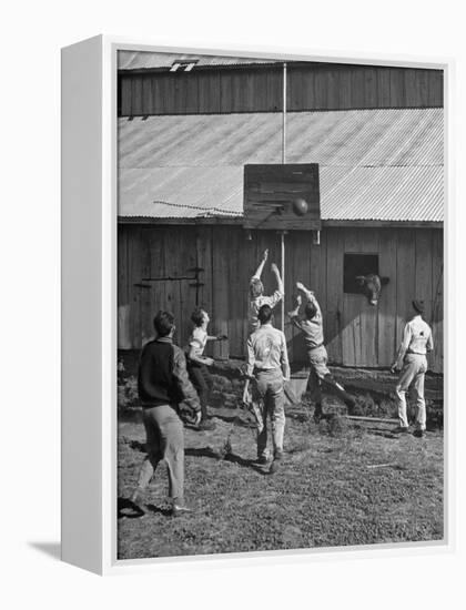 Young Men Playing Basketball with a Homemade Basket in a Farmyard-null-Framed Premier Image Canvas