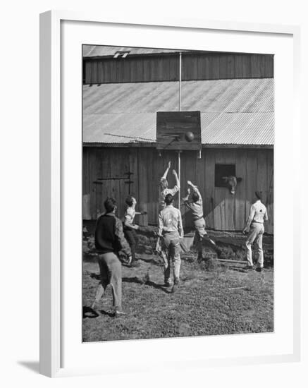 Young Men Playing Basketball with a Homemade Basket in a Farmyard-null-Framed Premium Photographic Print