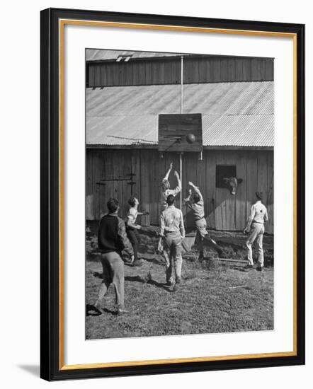 Young Men Playing Basketball with a Homemade Basket in a Farmyard-null-Framed Premium Photographic Print