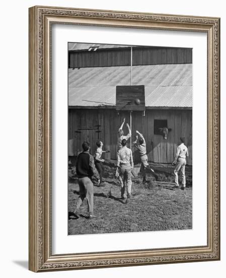 Young Men Playing Basketball with a Homemade Basket in a Farmyard--Framed Photographic Print