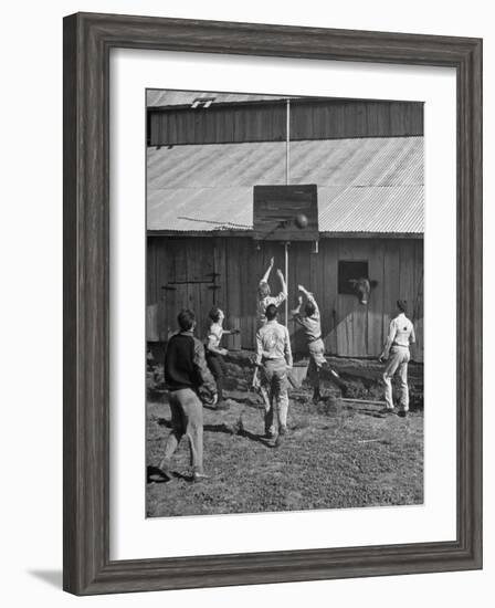 Young Men Playing Basketball with a Homemade Basket in a Farmyard--Framed Photographic Print