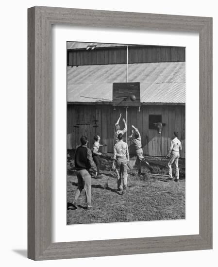 Young Men Playing Basketball with a Homemade Basket in a Farmyard-null-Framed Photographic Print