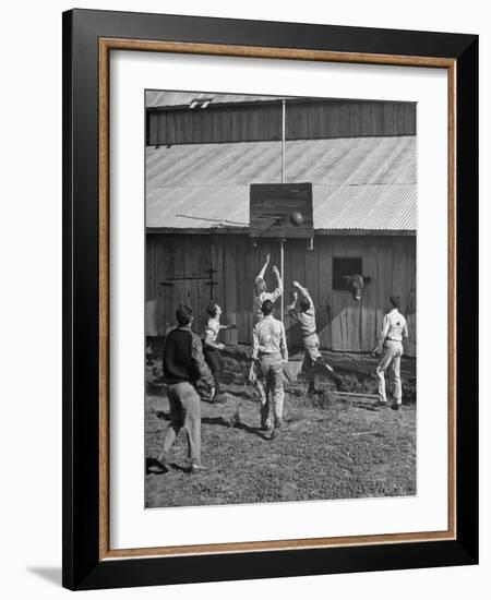 Young Men Playing Basketball with a Homemade Basket in a Farmyard-null-Framed Photographic Print