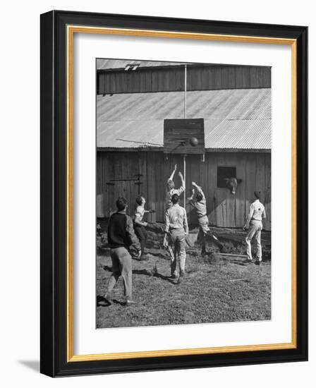 Young Men Playing Basketball with a Homemade Basket in a Farmyard-null-Framed Photographic Print