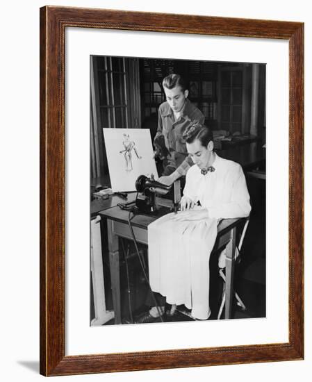 Young Men Using Sewing Machine-null-Framed Photo