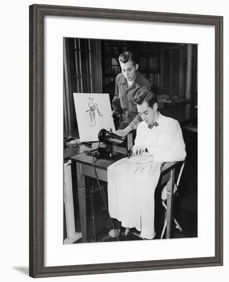 Young Men Using Sewing Machine-null-Framed Photo