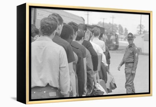 Young men who have been drafted wait in line to be processed into the US Army at Fort Jackson, SC-Warren K. Leffler-Framed Premier Image Canvas