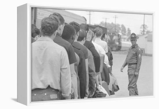 Young men who have been drafted wait in line to be processed into the US Army at Fort Jackson, SC-Warren K. Leffler-Framed Premier Image Canvas