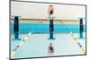 Young Muscular Swimmer Jumping from Starting Block in a Swimming Pool-NejroN Photo-Mounted Photographic Print