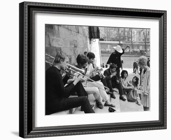 Young Parisian Musicians Enjoying an Impromptu Outdoor Concert on the Banks of the Seine River-Alfred Eisenstaedt-Framed Photographic Print