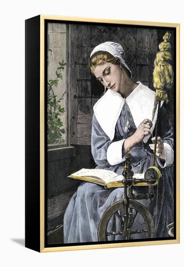 Young Puritan Woman Reading While Spinning at Her Wheel-null-Framed Premier Image Canvas