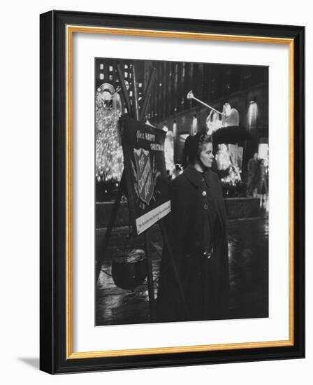 Young Salvation Army Volunteer Soliciting Christmas Time Contributions at Rockefeller Center-Peter Stackpole-Framed Photographic Print