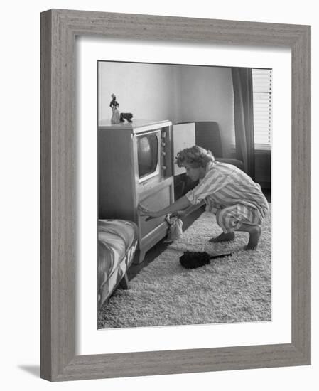 Young Woman Attending to Her Housework by Dusting Off Her Television Set-Nina Leen-Framed Photographic Print