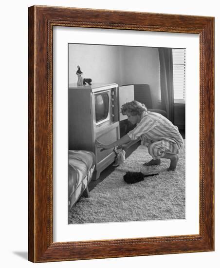 Young Woman Attending to Her Housework by Dusting Off Her Television Set-Nina Leen-Framed Photographic Print