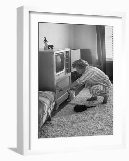 Young Woman Attending to Her Housework by Dusting Off Her Television Set-Nina Leen-Framed Photographic Print