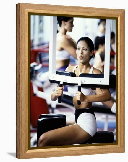 Young Woman Exercising in a Gym-null-Framed Premier Image Canvas