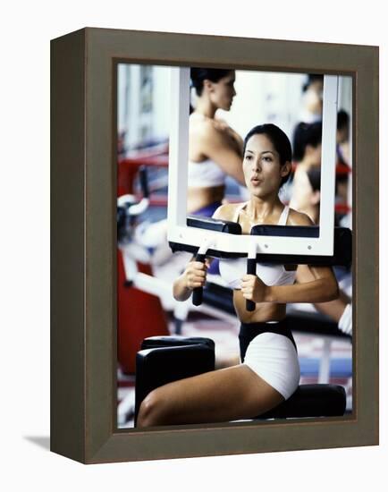 Young Woman Exercising in a Gym-null-Framed Premier Image Canvas