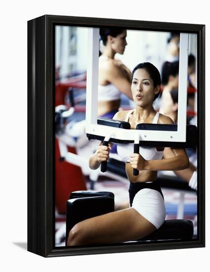 Young Woman Exercising in a Gym-null-Framed Premier Image Canvas