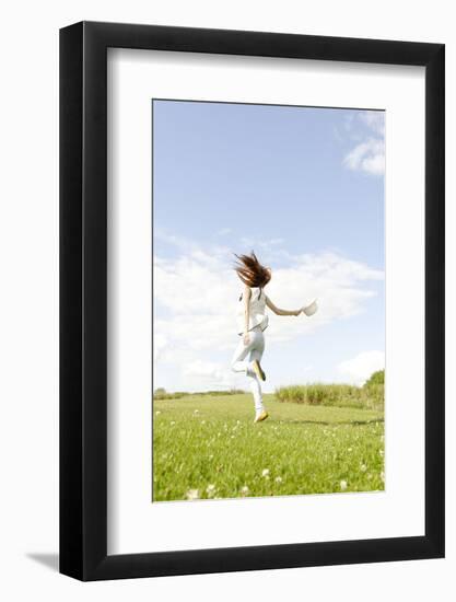 Young Woman, Fun, Meadow, Jumping-Axel Schmies-Framed Photographic Print