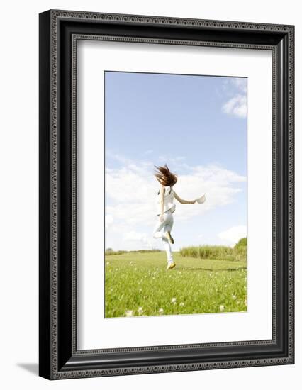 Young Woman, Fun, Meadow, Jumping-Axel Schmies-Framed Photographic Print