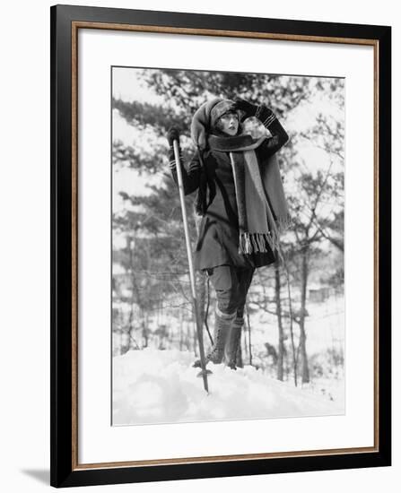 Young Woman Hikes Through Snow Covered Woods-null-Framed Photo