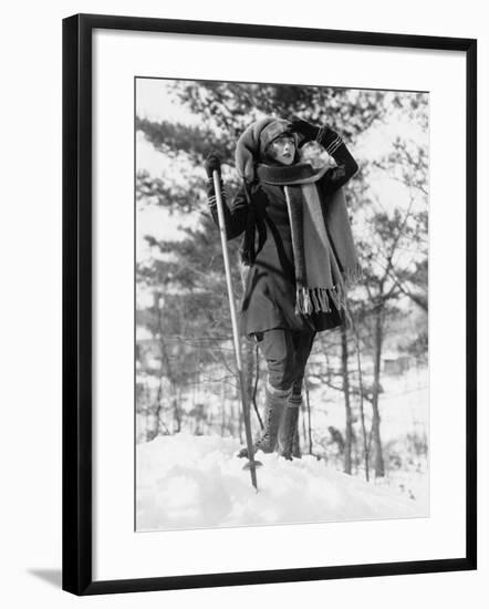 Young Woman Hikes Through Snow Covered Woods-null-Framed Photo