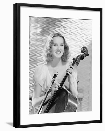 Young Woman Holding a Bow and Cello-null-Framed Photo