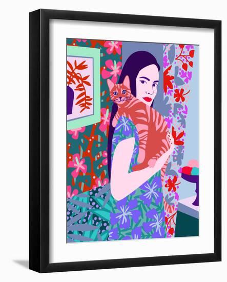 Young woman holding a cat in bright decorated interior.-Galina Kamenskaya-Framed Art Print