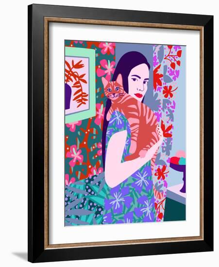Young woman holding a cat in bright decorated interior.-Galina Kamenskaya-Framed Art Print