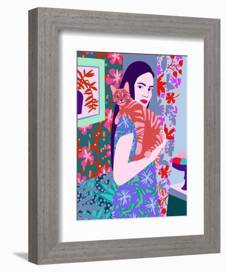 Young woman holding a cat in bright decorated interior.-Galina Kamenskaya-Framed Premium Giclee Print