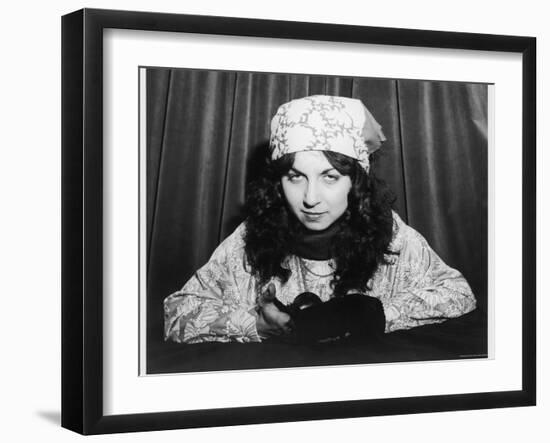 Young Woman Holding a Crystal Ball-null-Framed Photographic Print