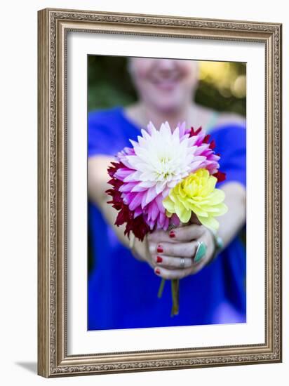 Young Woman Holding Flowers-Justin Bailie-Framed Photographic Print