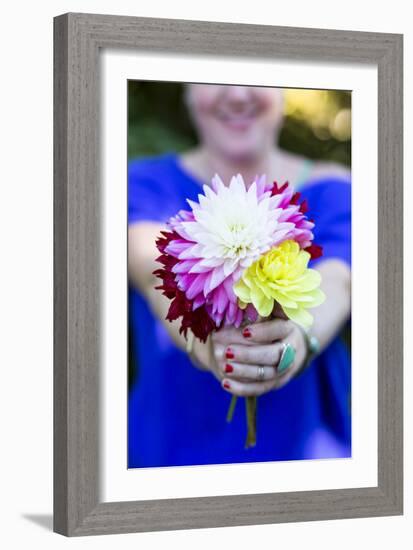 Young Woman Holding Flowers-Justin Bailie-Framed Photographic Print