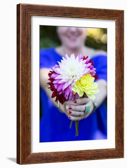 Young Woman Holding Flowers-Justin Bailie-Framed Photographic Print