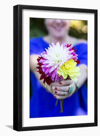 Young Woman Holding Flowers-Justin Bailie-Framed Photographic Print