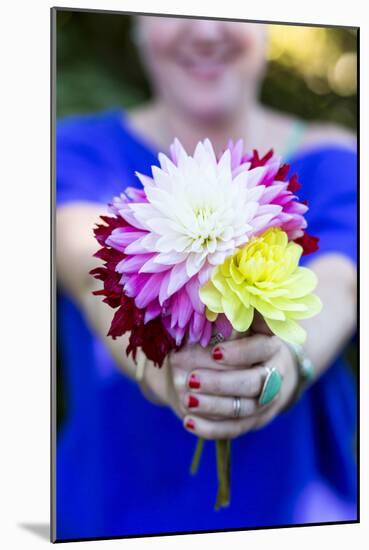 Young Woman Holding Flowers-Justin Bailie-Mounted Photographic Print