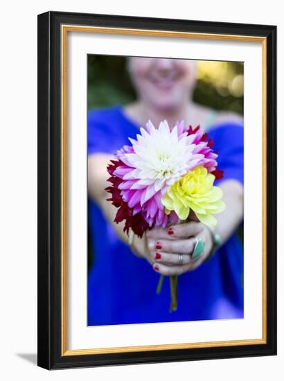 Young Woman Holding Flowers-Justin Bailie-Framed Photographic Print