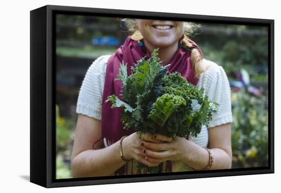 Young Woman Holding Fresh Vegetables Out Of The Garden-Justin Bailie-Framed Premier Image Canvas