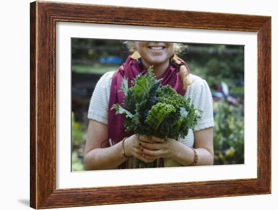 Young Woman Holding Fresh Vegetables Out Of The Garden-Justin Bailie-Framed Photographic Print