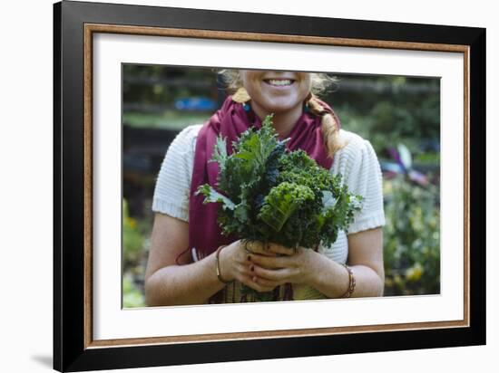 Young Woman Holding Fresh Vegetables Out Of The Garden-Justin Bailie-Framed Photographic Print