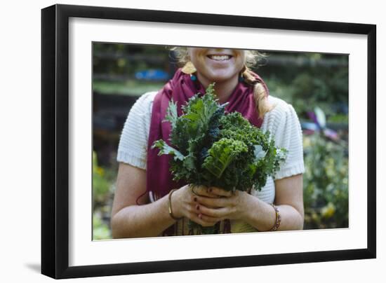 Young Woman Holding Fresh Vegetables Out Of The Garden-Justin Bailie-Framed Photographic Print